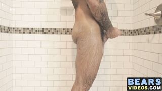 bear washes his furry body and spanks his thick monkey