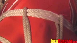 hunk in uniform is tied up as he tries to release himself2